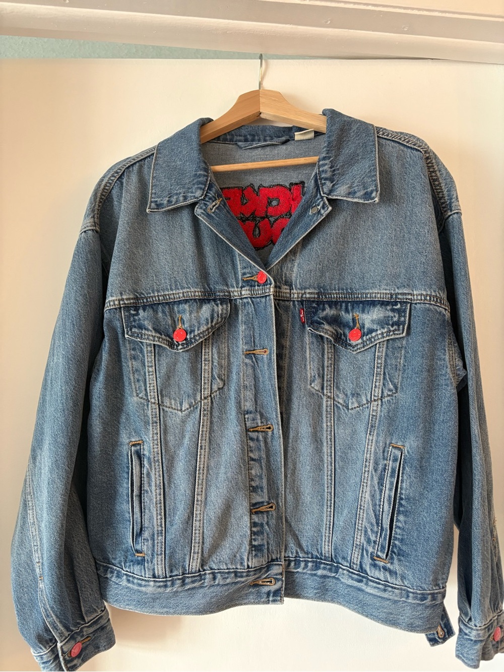 Levi's Women's Light Wash Denim Trucker Jacket with Red Accent Buttons